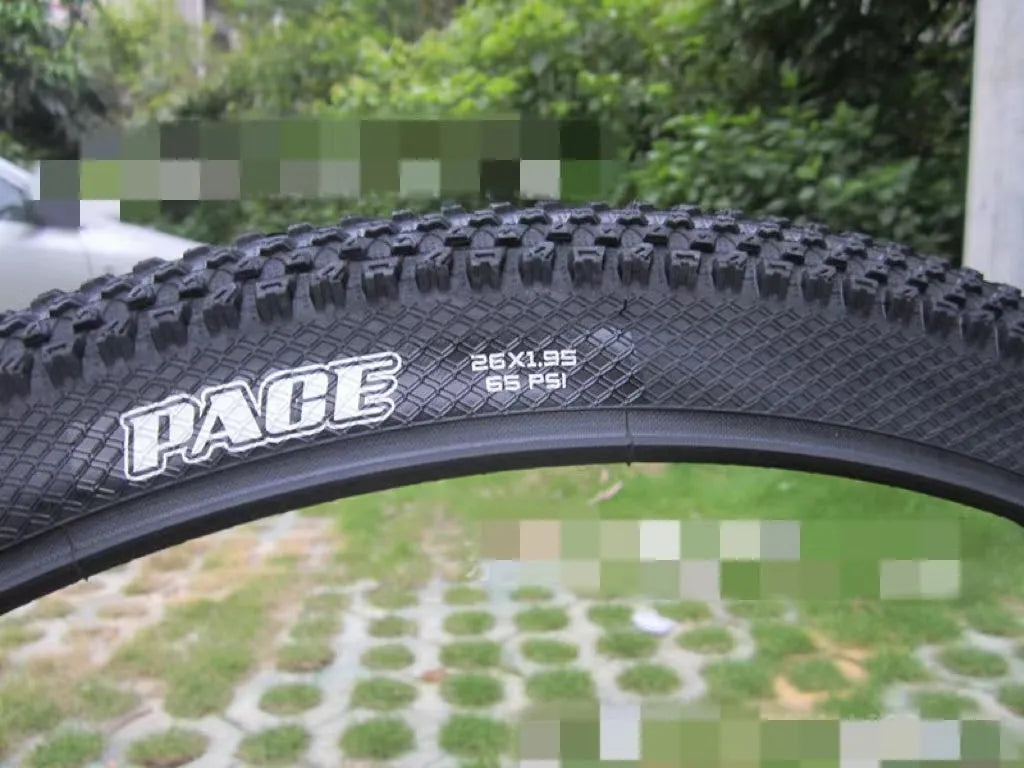 Ultralight puncture-proof mountain bike tyre shown in multiple sizes including 26, 27.5 and 29-inch options.