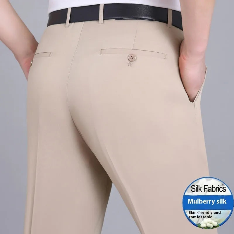 Men's straight cut black mulberry silk blend business trousers with high waist on a hanger.