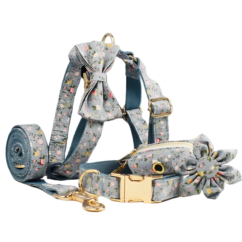 Blue floral patterned fabric bow attached to a decorative dog collar for pets