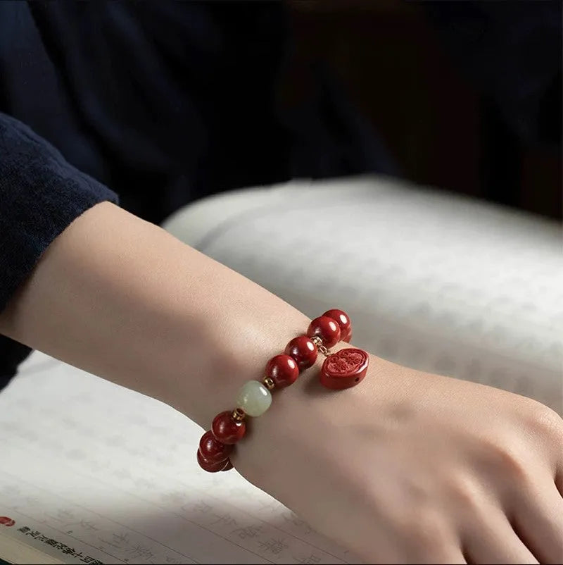 Cinnabar Emperor Sandstone bracelet with Ping An Fu Lu motifs in 8mm or 10mm bead sizes