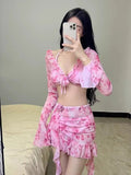 Women's floral bikini swimsuit in cherry blossom colours for beach and hot spring use