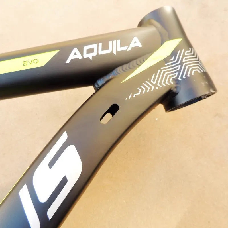 Black green 29-inch aluminium mountain bike frame showing internal cable ports and disc brake mount.