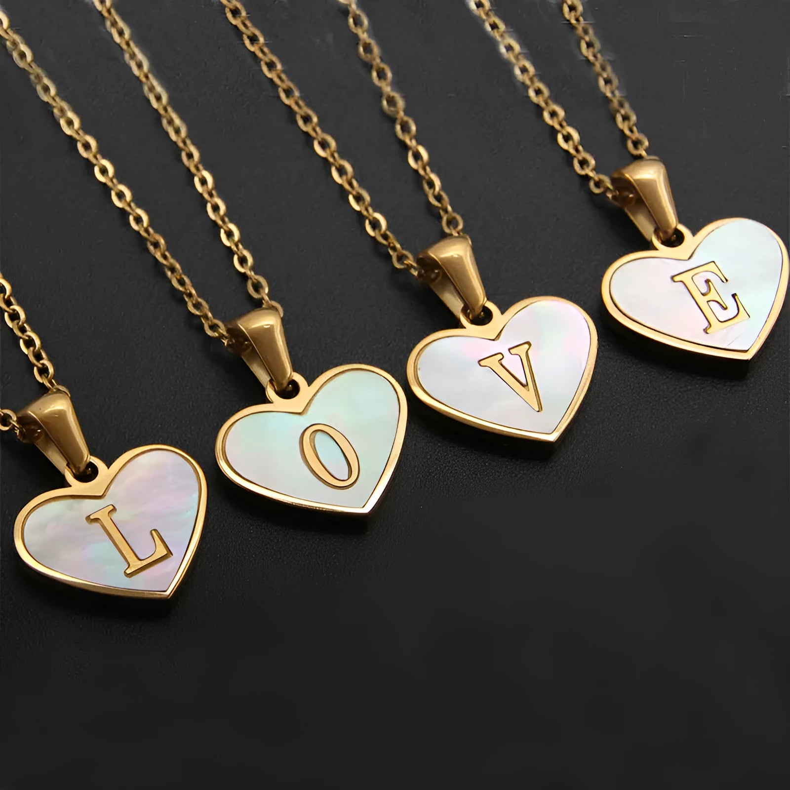 Gold plated heart pendant necklace with white shell centre and personalised letter engraving on adjustable chain