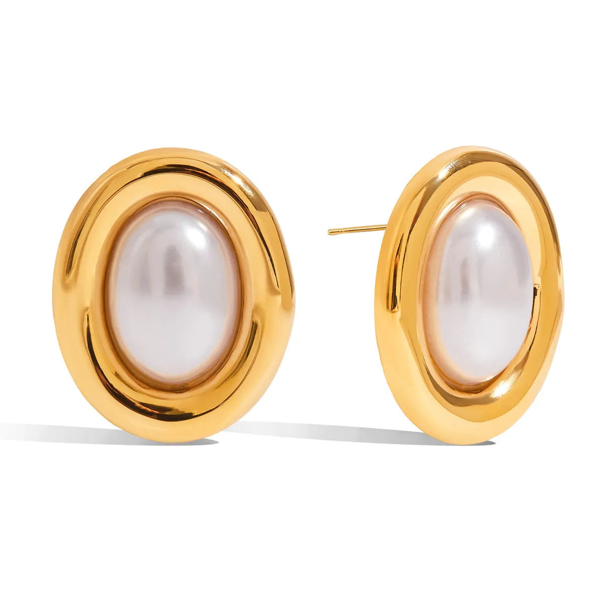 A pair of stainless steel post ear studs with small vintage-style pearl accents on a silver-tone background.