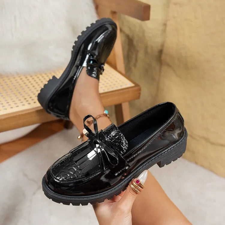 Women's brown loafers with decorative bow detail on artificial PU upper