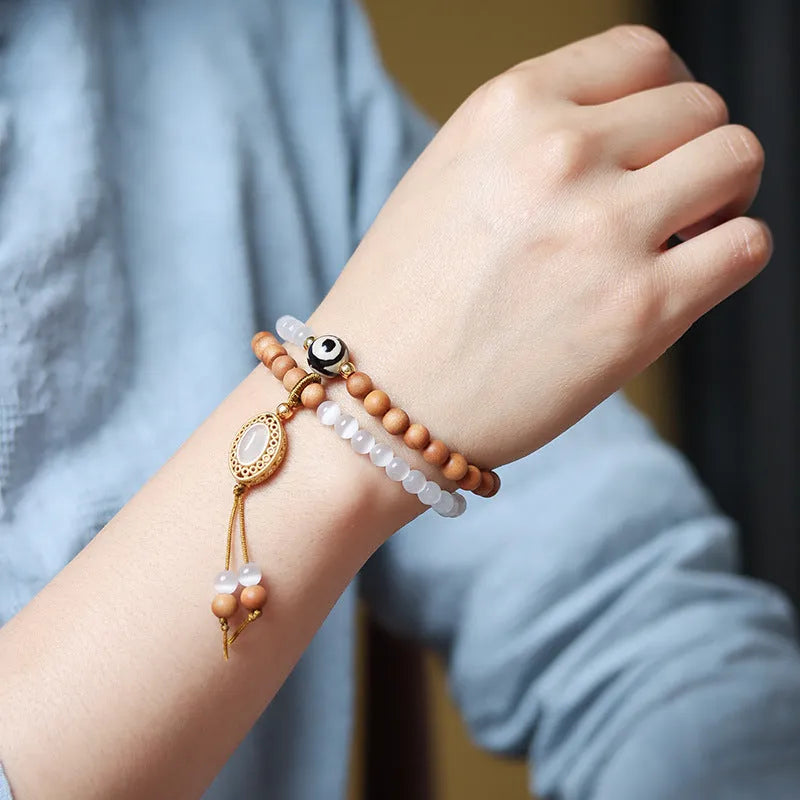 Sandalwood and opal Tibetan beads bracelet with polished double rings in Barbie colour