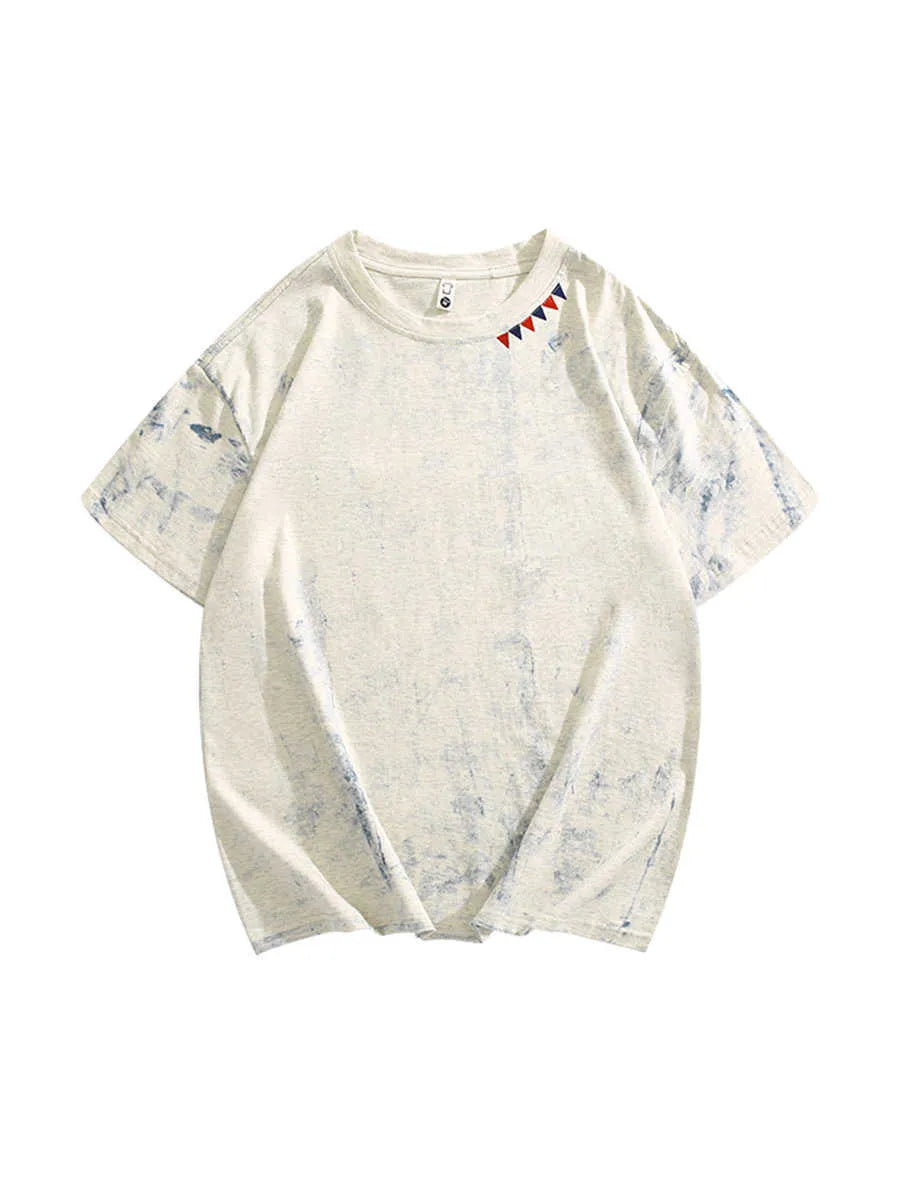 Grey loose fit short sleeve t-shirt with a full body tie dye pattern, showing round neck collar.