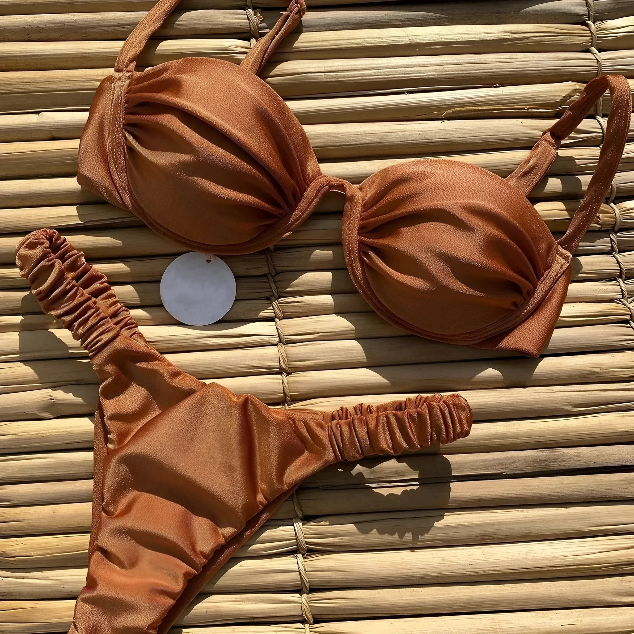 Women's black underwire bikini swimsuit set with brief bottoms on a mannequin.