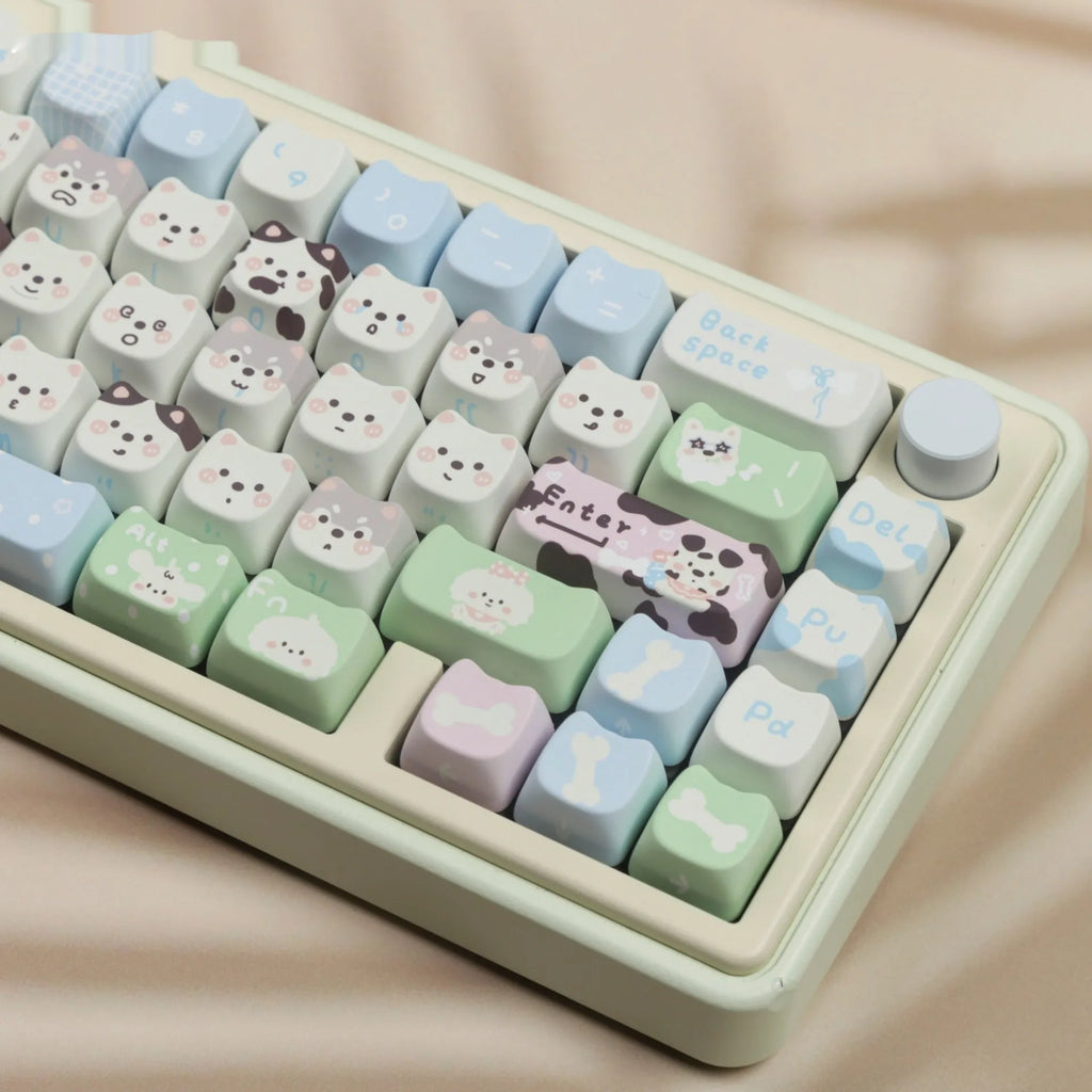 PBT sublimation key cap set showing colourful puppy and cat artwork on mechanical keyboard keys