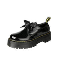 Women's thick soled leather shoes with ribbon cross straps and lace-up closure in black colour