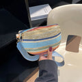 Blue straw woven women's beach bag with single shoulder strap and zippered compartment