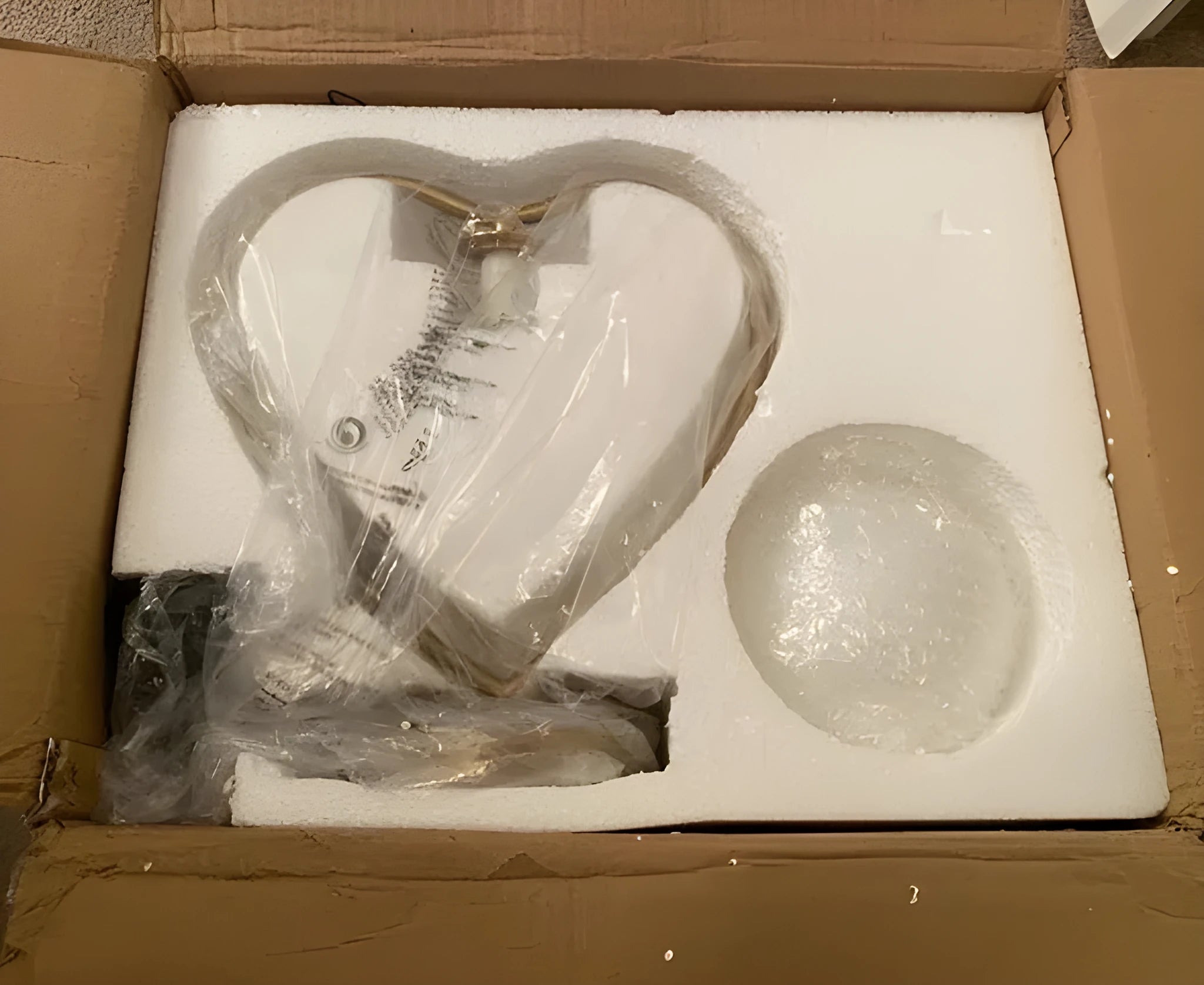 Heart shaped warm white LED decorative lamp on table with UK plug