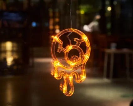 Halloween window hanging LED lights set with seven designs including spiders, pumpkins, and ghosts