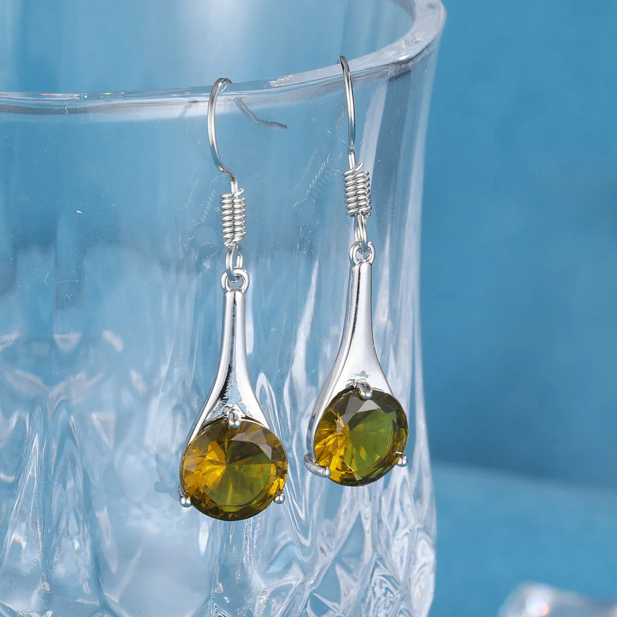 Olive green topaz drop-shaped earrings with retro design on alloy with electroplated finish