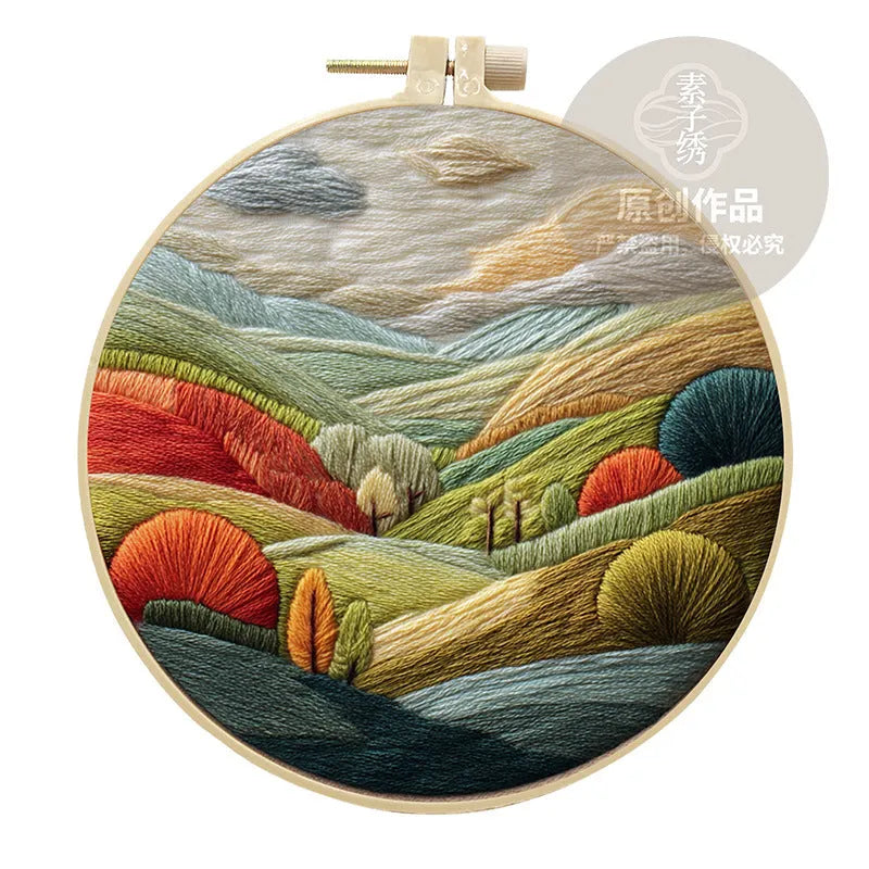 Embroidery DIY landscape kit with cotton fabric, bamboo frame, scissors, and thread for scenic designs