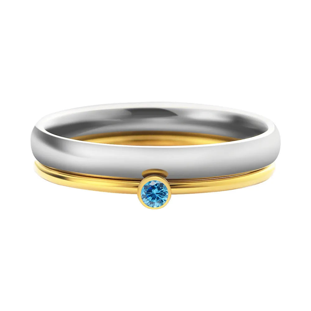 A geometric engraved titanium steel ring featuring a December birthstone colour.