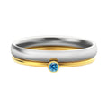 A geometric engraved titanium steel ring featuring a December birthstone colour.