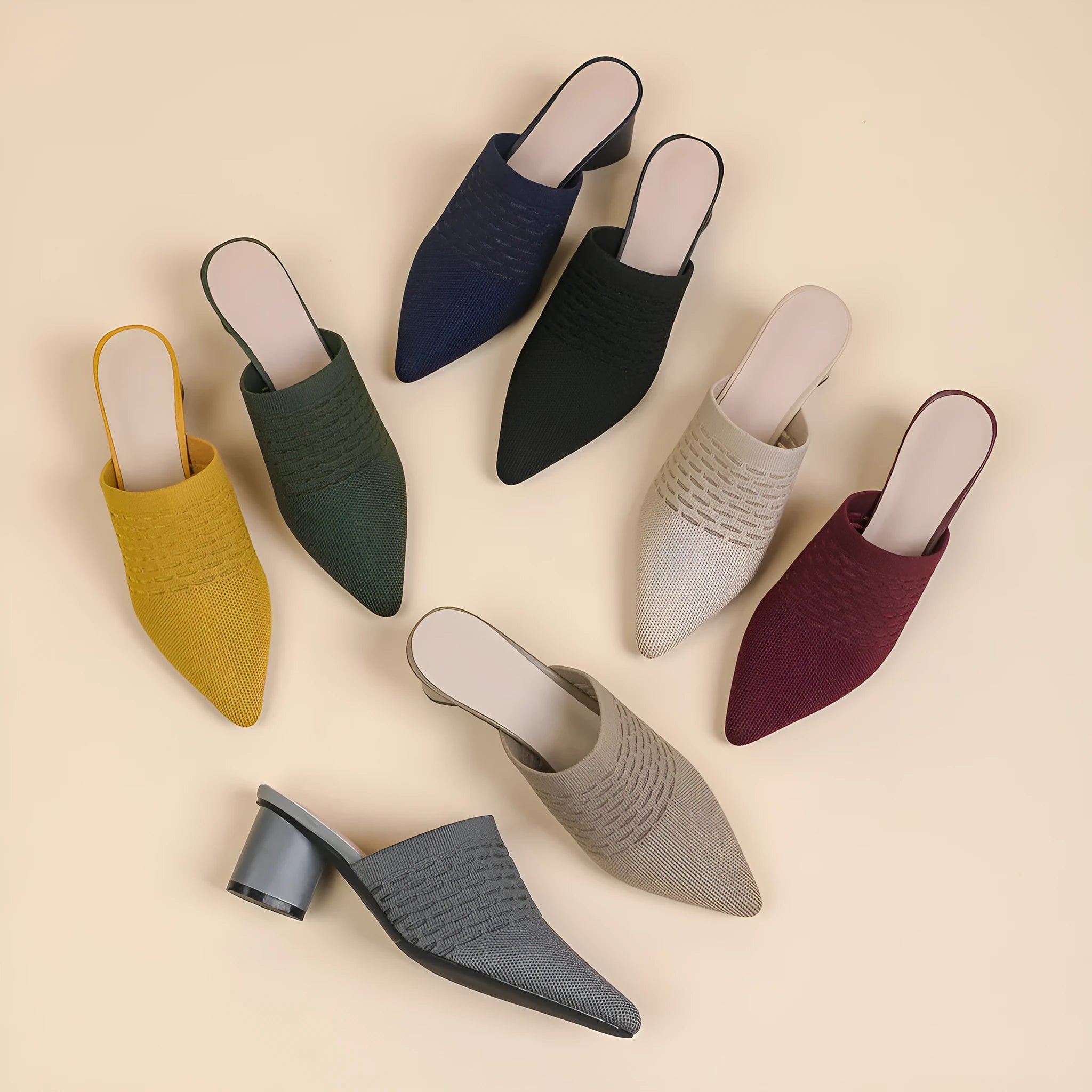 Women's black pointed toe sandals with a fabric upper and 5cm chunky rubber heel.