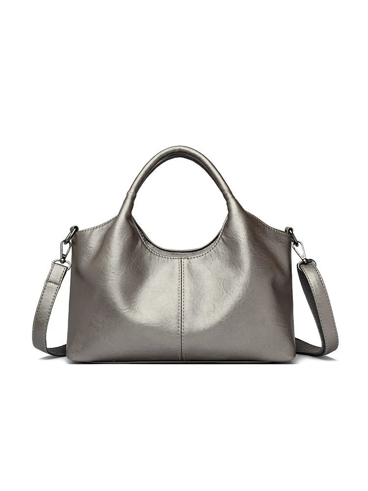A genuine leather women's cross-body bag in a choice of seven colours including black, brown, and wine red.