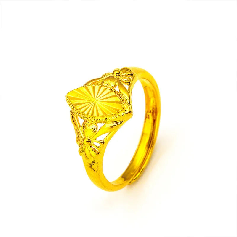 Gold electroplated open flower ring with geometric texture on adjustable brass band