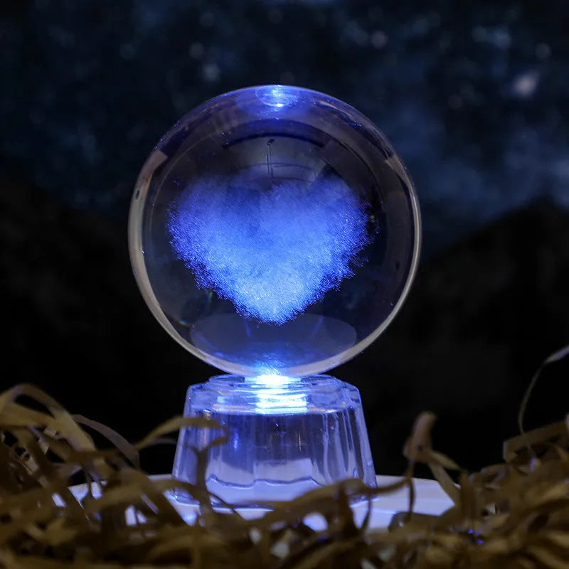 Transparent 6cm crystal ball ornament with inner carving on wooden table