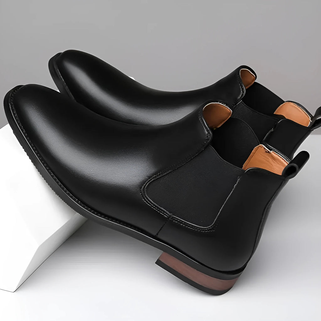Men's black Chelsea boots with pointed toe and artificial PU leather upper on rubber sole