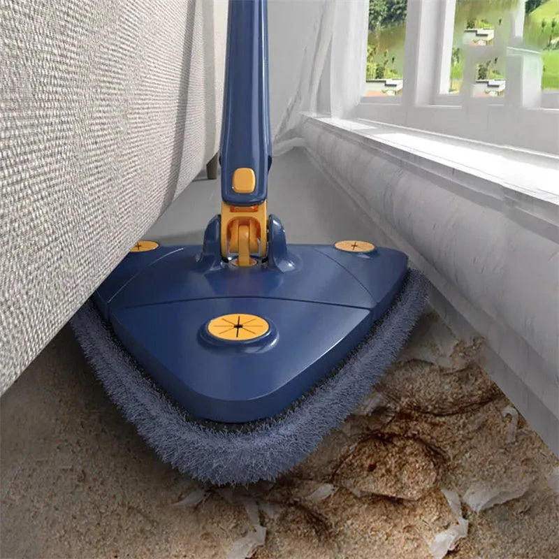 Blue extendable triangle mop with rotating head and microfibre cloth on a tiled floor.