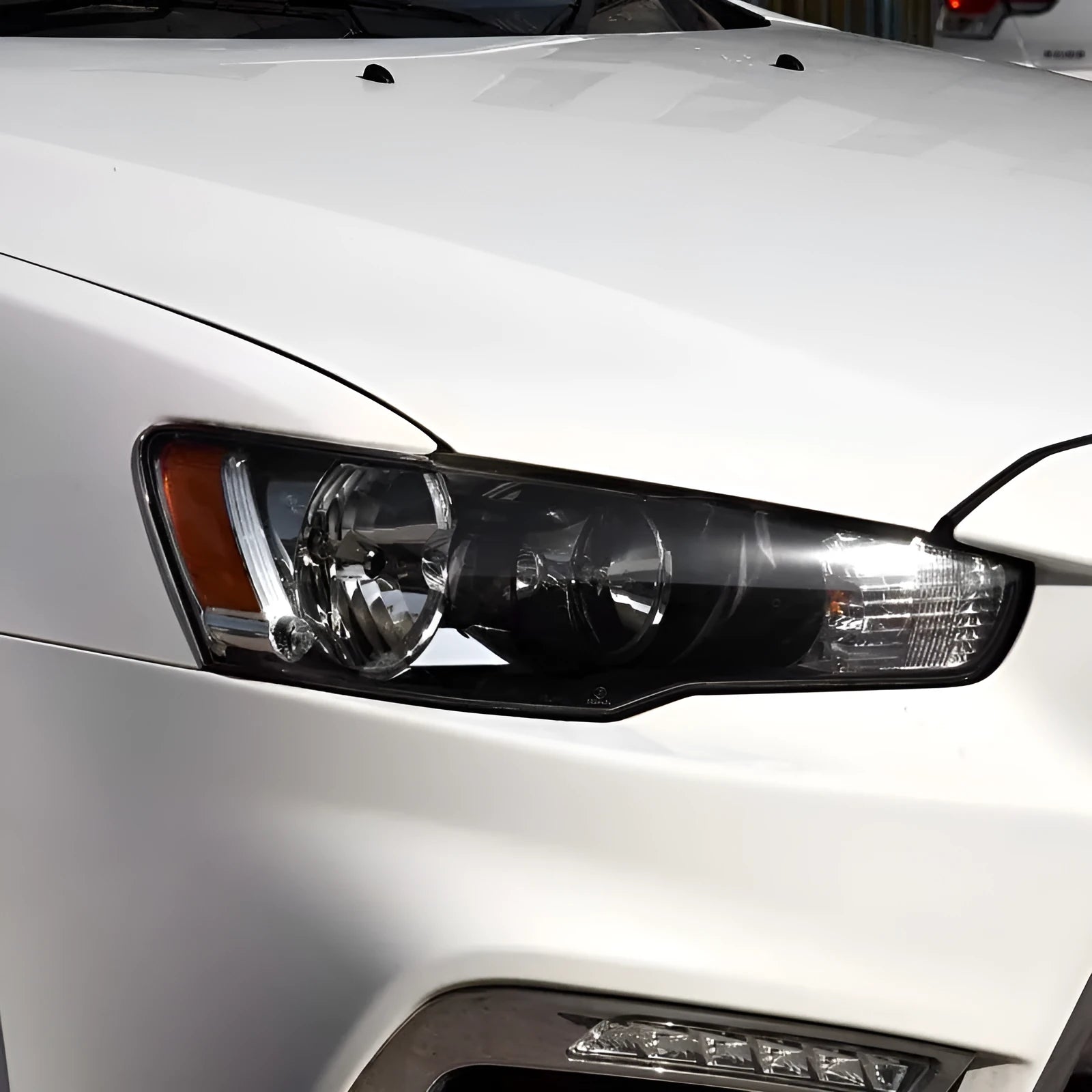 Transparent plastic headlight housing covers for main driver and co-pilot vehicle lamps
