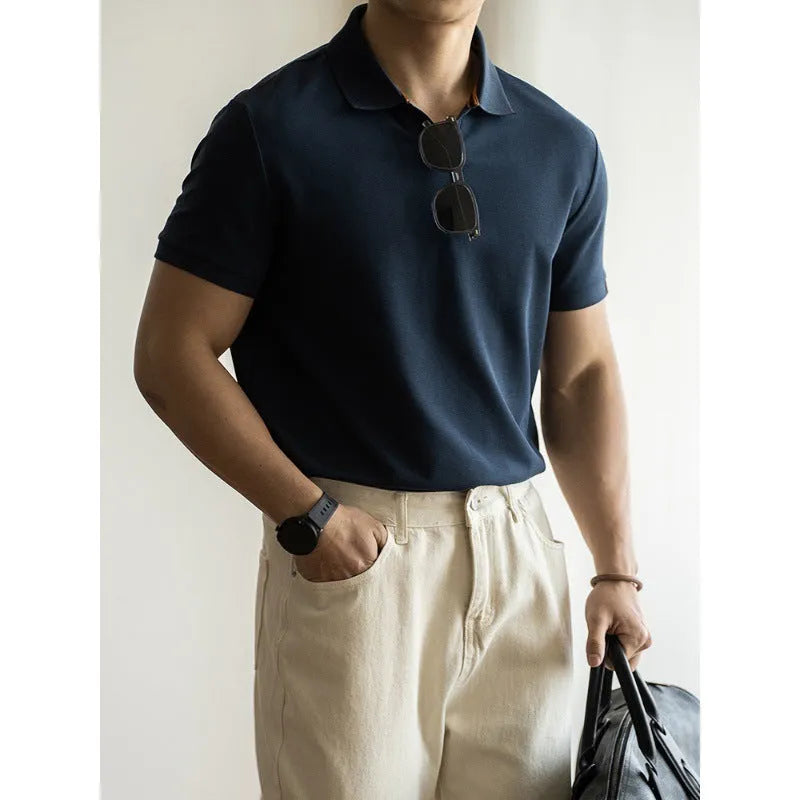 Men's blue cotton blend short-sleeve polo shirt on a hanger, showing the collar and regular fit.