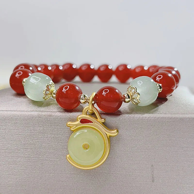 Red agate bracelet for women with dragon motifs and traditional Chinese lucky charms