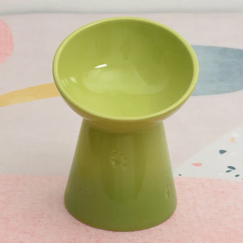 Ceramic pet bowl with high foot design showing anti-tumble stability feature
